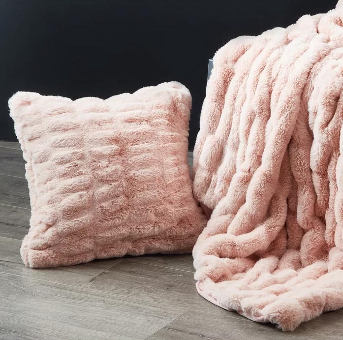 pink pillow and throw