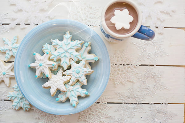 Snowflakes cookies and hot chocolate with snowflake mallows